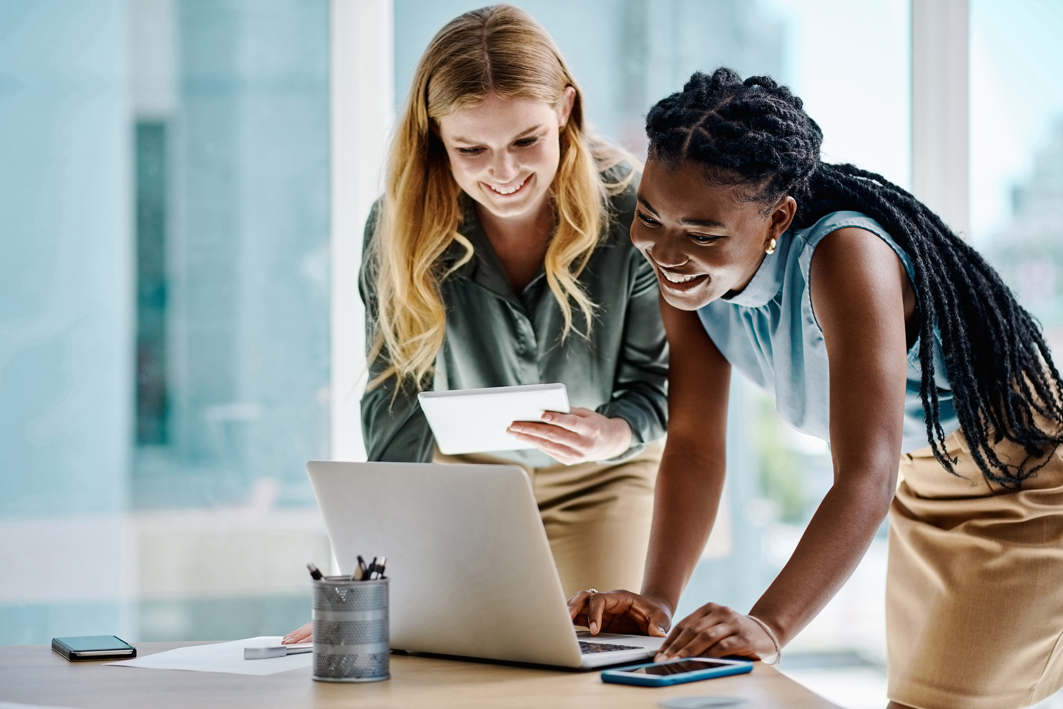 two-women-working-at-laptop