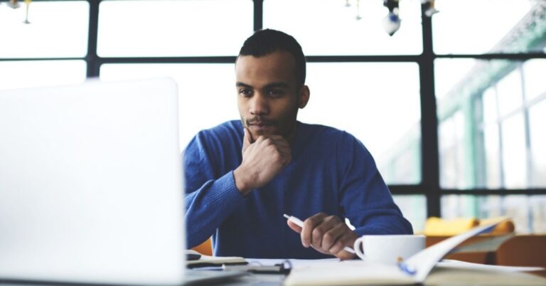 Man staring at a laptop screen