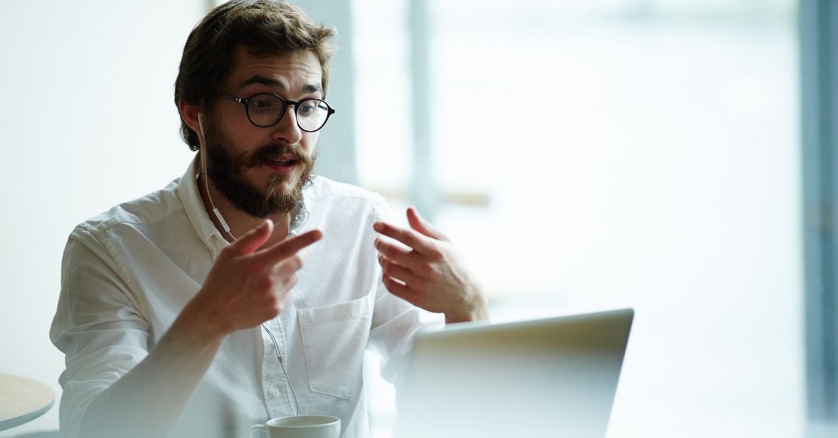 Man talking to someone on a laptop